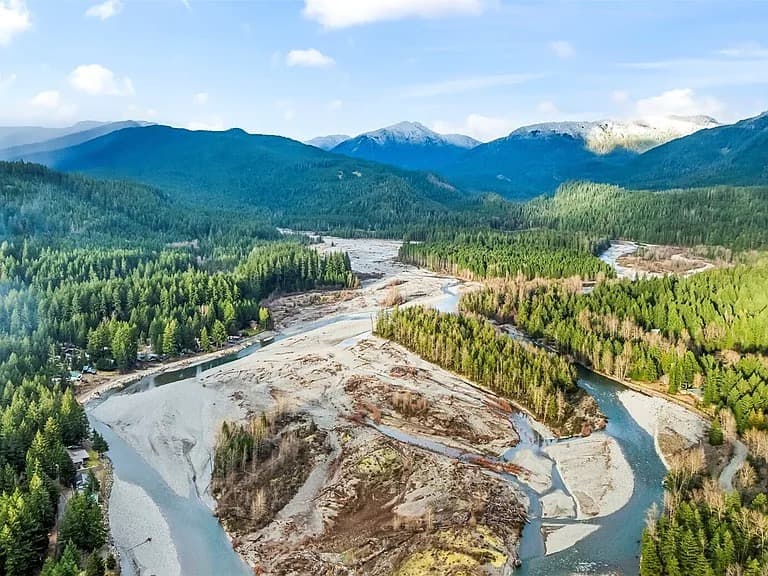 Aerial view of High Valley showing the Cowlitz River, surrounding forests, and the protective berm built by HVCR